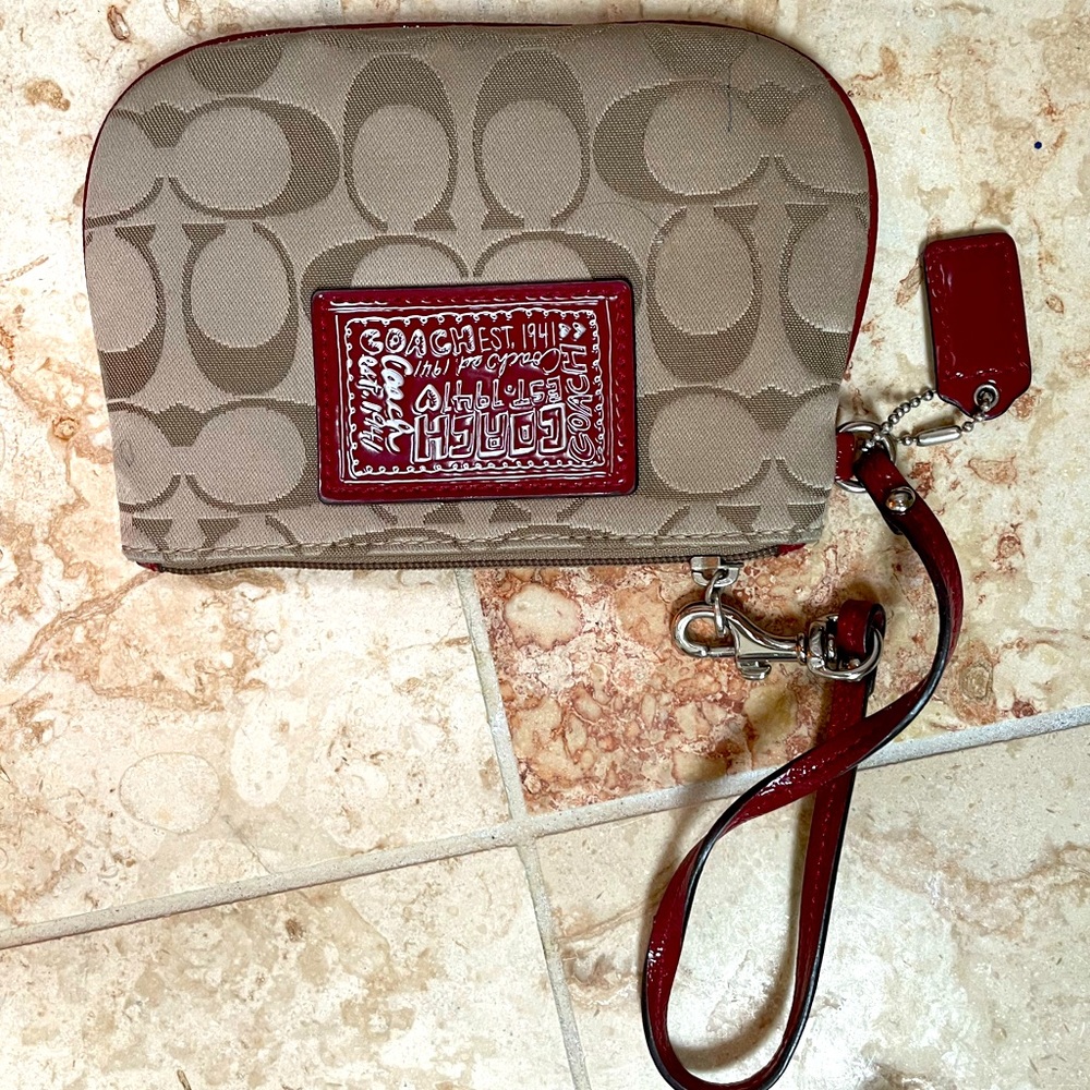 Coach wristlet.  Cute little wristlet with some wear see photos for details.